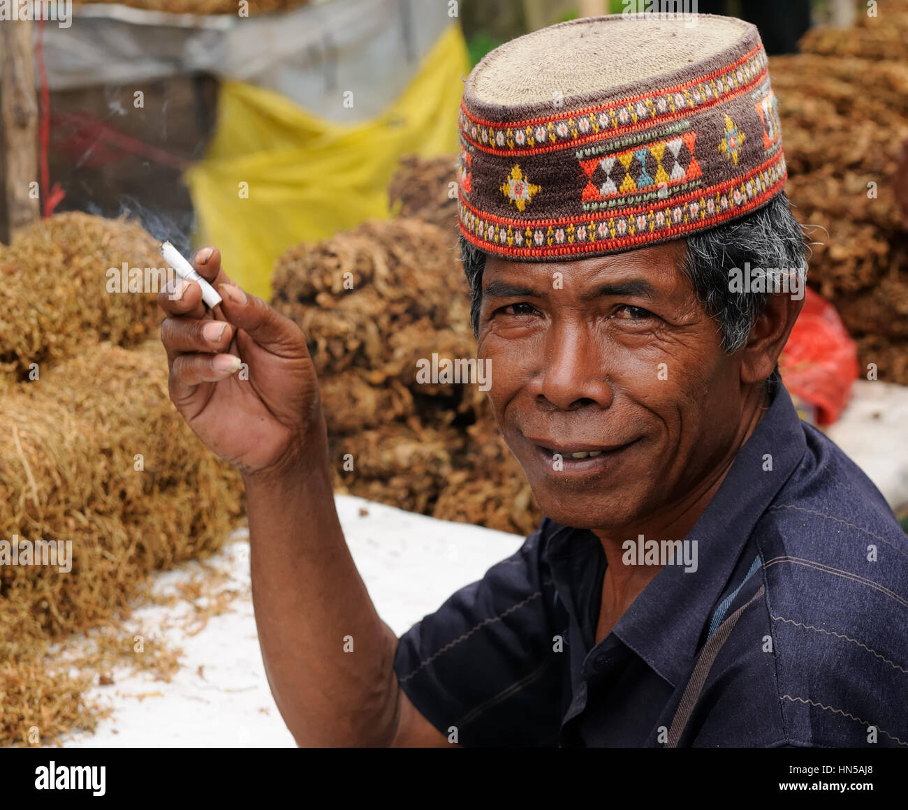 RUTENG, FLORES, INDONESIA - APRIL 20: Seller of the tobacco plant on ...
