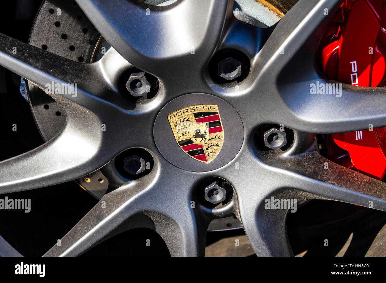 Indianapolis - Circa February 2017: Traditional Porsche Wheel Logo on a new 911. Porsche Racing Dates to the 1950s V Stock Photo