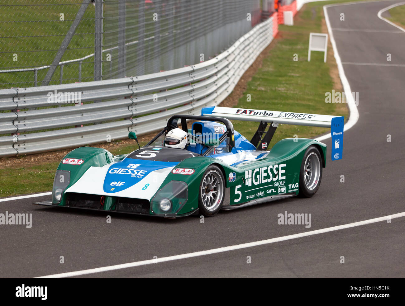 A 1998, Ferrari 333SP, coming into the pit lane, after the 90's Endurance Legends demonstration at the 2016 Silverstone Classic Stock Photo