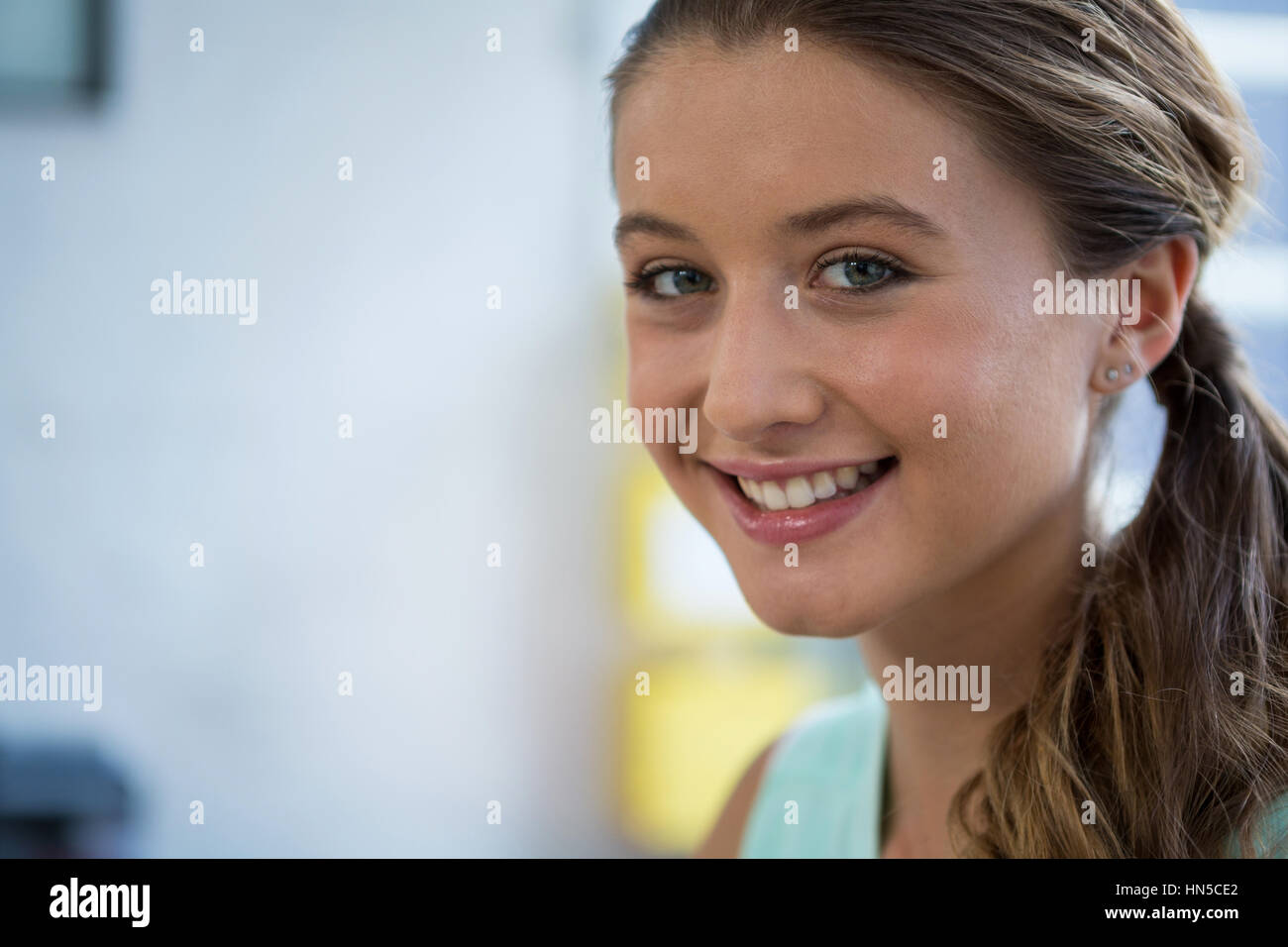 Portrait of business executive smiling at camera in office Stock Photo ...