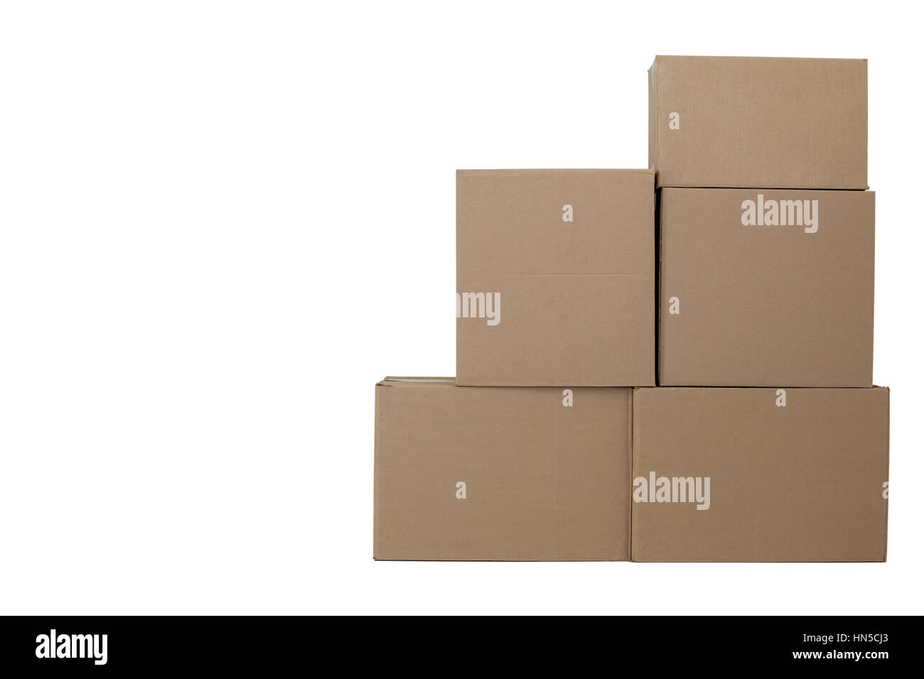 Stack of cardboard boxes against white background Stock Photo - Alamy