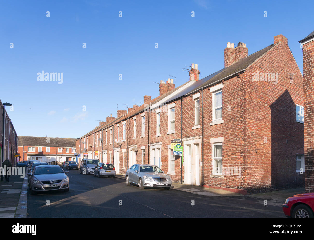 A terrace of brick built Tyneside flats, Laet Street, North Shields, England, UK Stock Photo