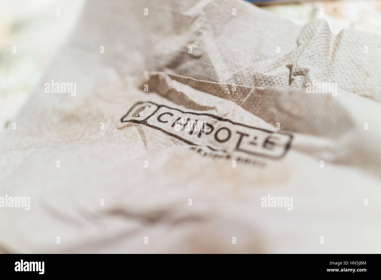 Brown crinkled napkin with Chipotle sign word Stock Photo