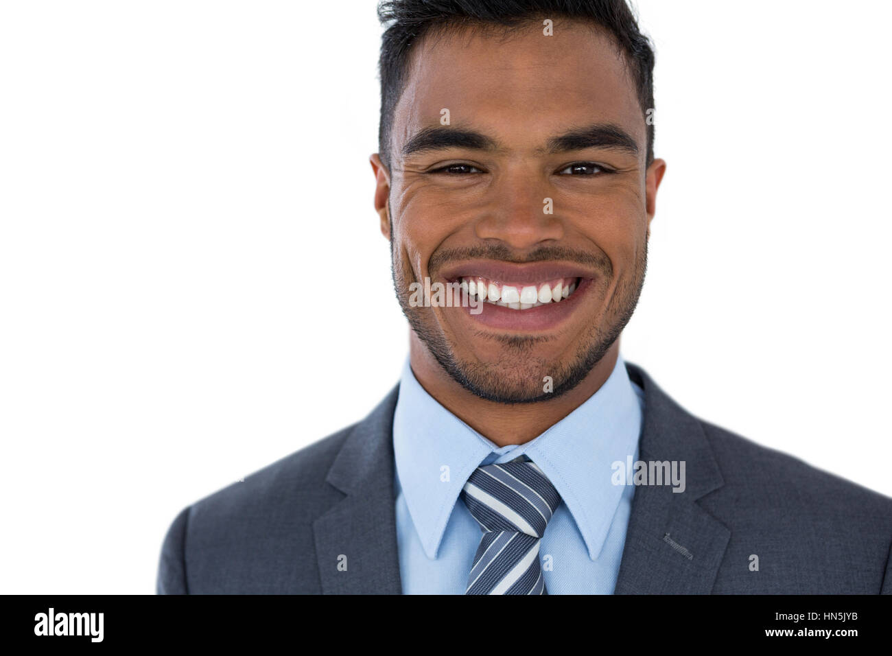 Portrait of smiling businessman standing against white background Stock ...