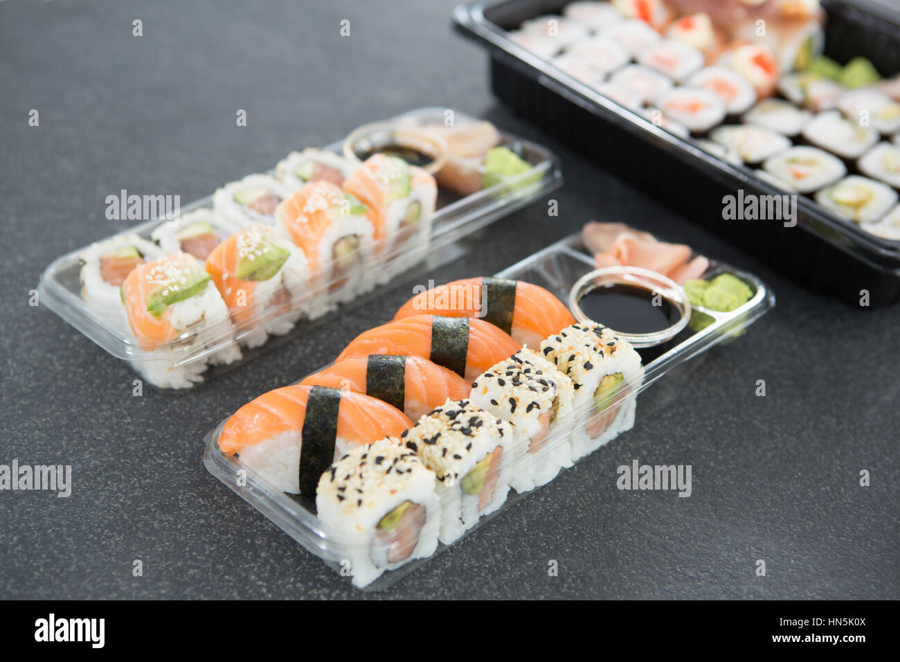 Closeup of various sushi rolls in platter with soy sauce Stock Photo Alamy