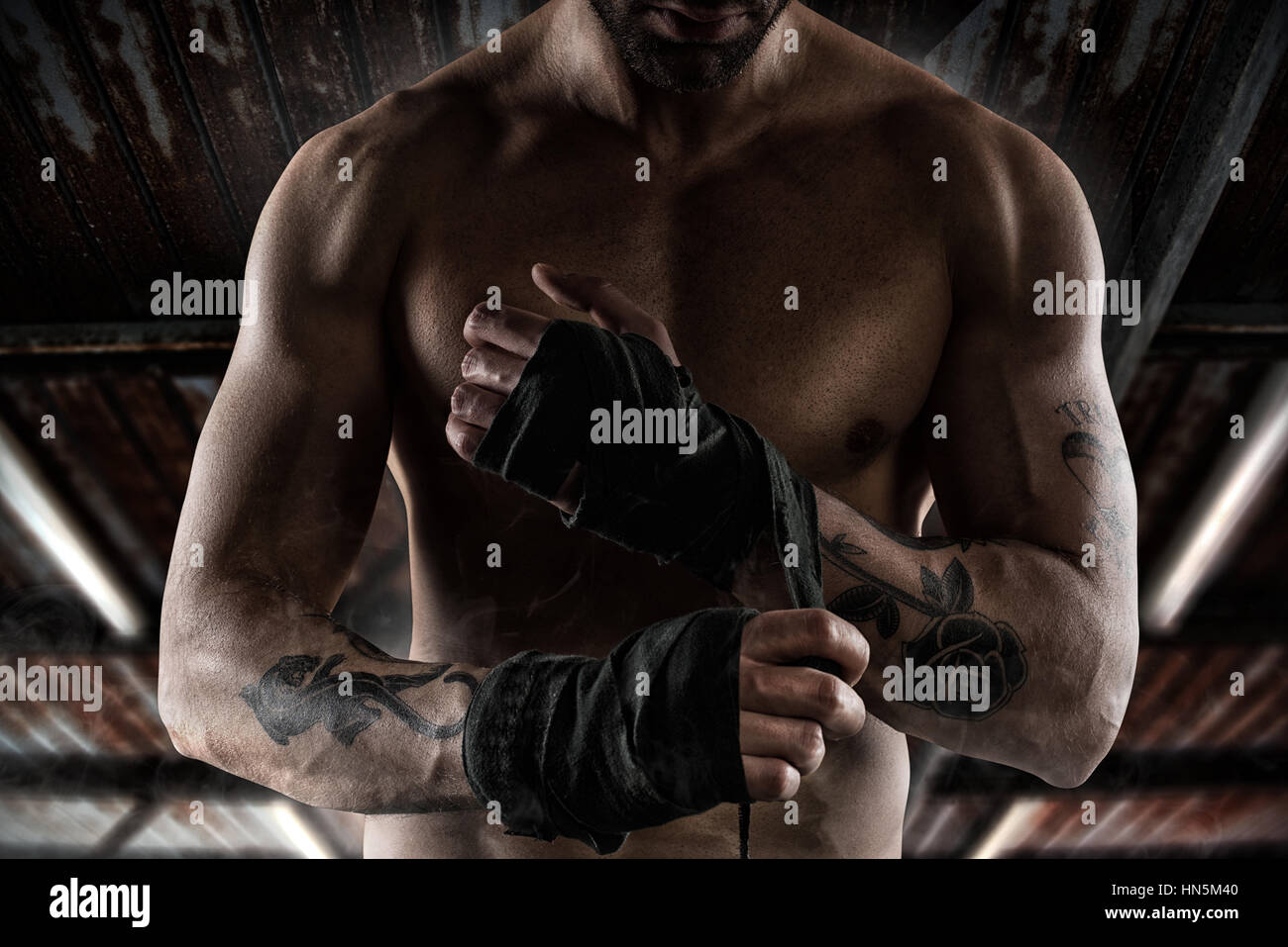 Boxer puts the tapes to his hands Stock Photo Alamy