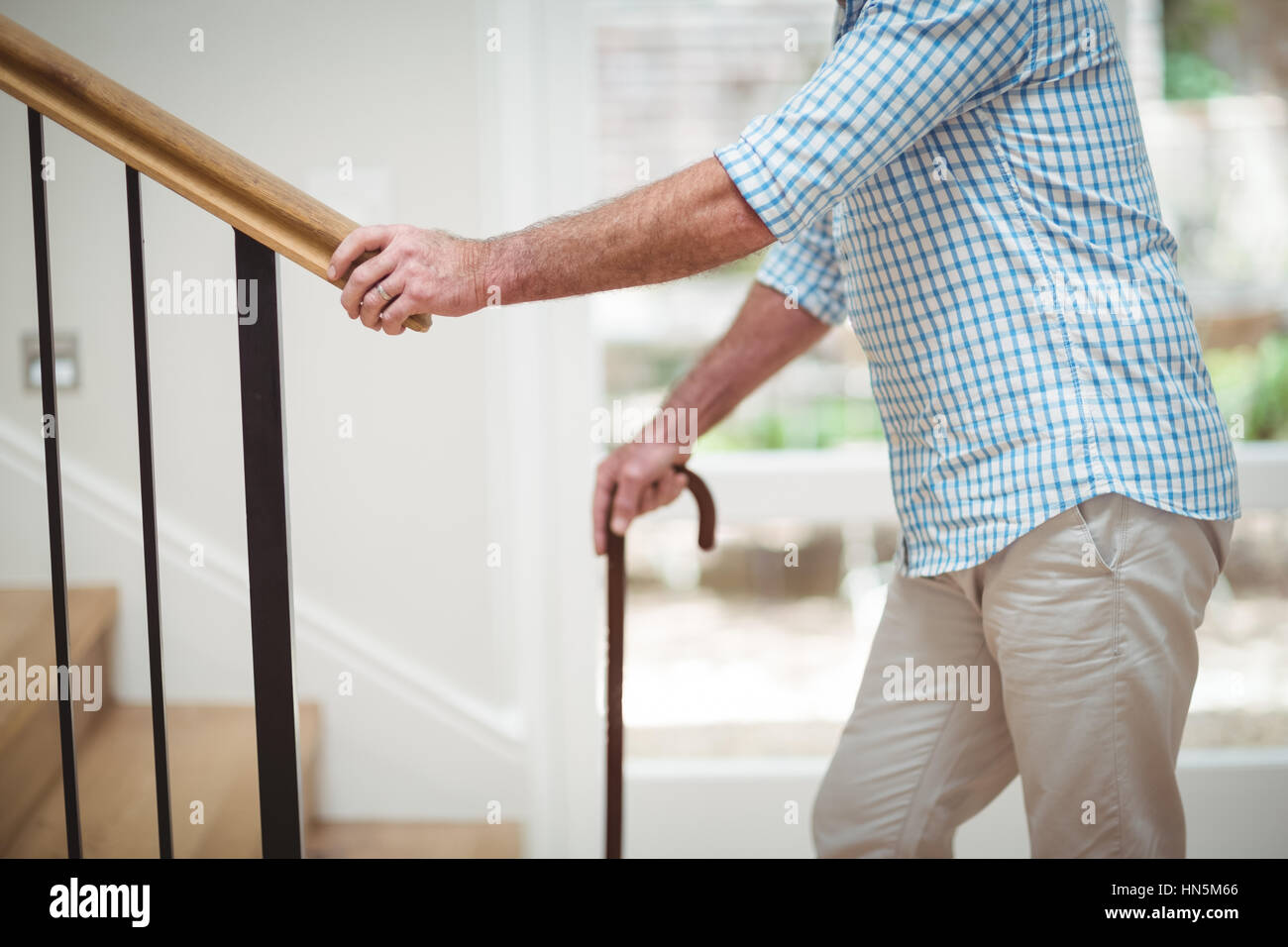 Man upstairs hires stock photography and images Alamy