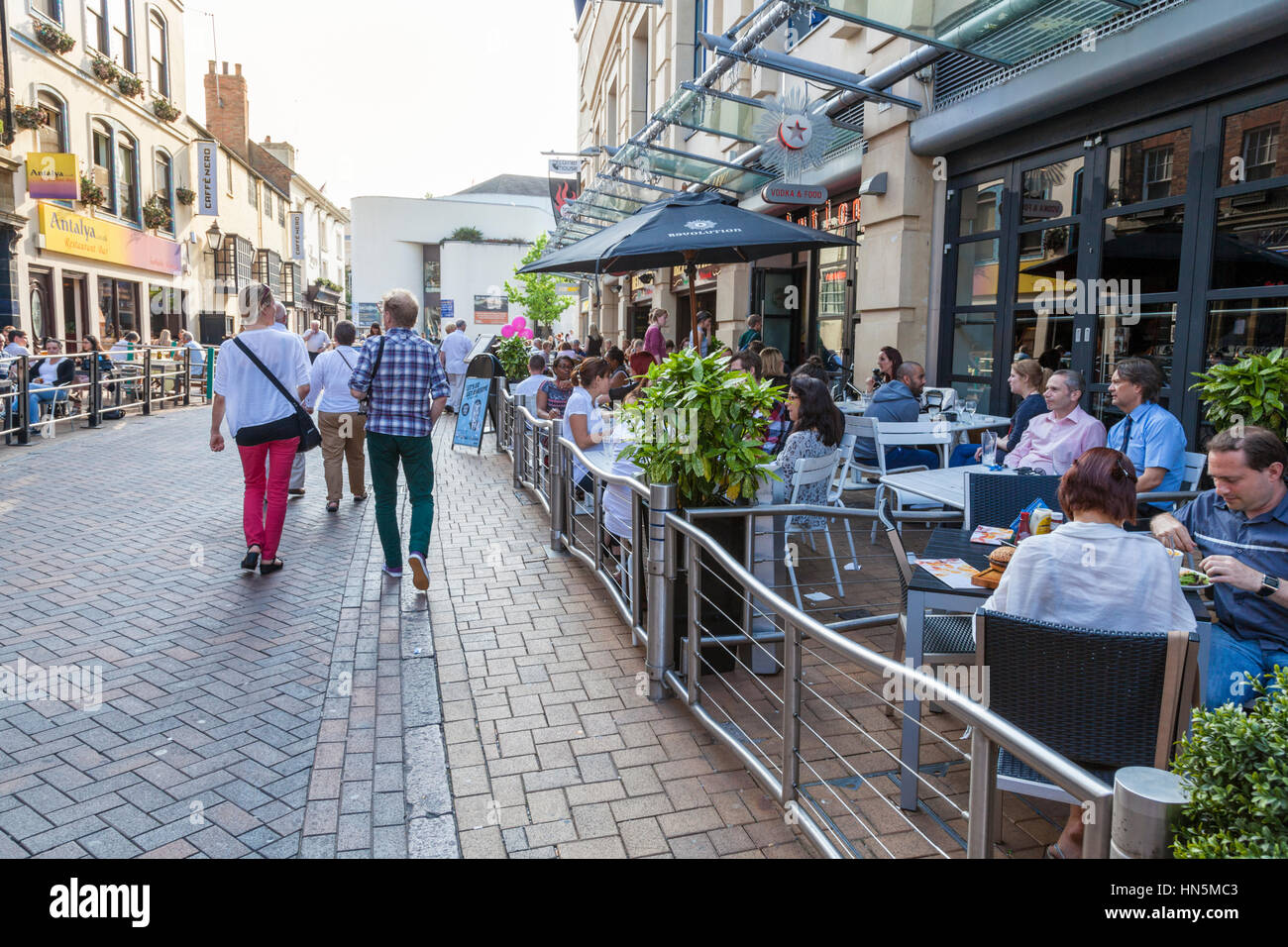 People eating and drinking outside at city centre restaurants on a Summer evening, Nottingham, England, UK Stock Photo