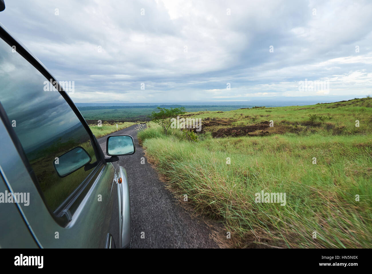 car move in volcano national park between green area Stock Photo Alamy