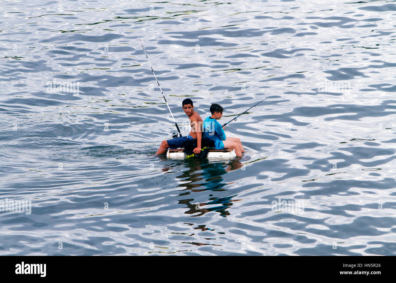 Fishermen use homemade styrofoam floating devices as boats. Fishing is not  only a favorite pastime for Cubans but it is also an income source. Fisherm  Stock Photo - Alamy