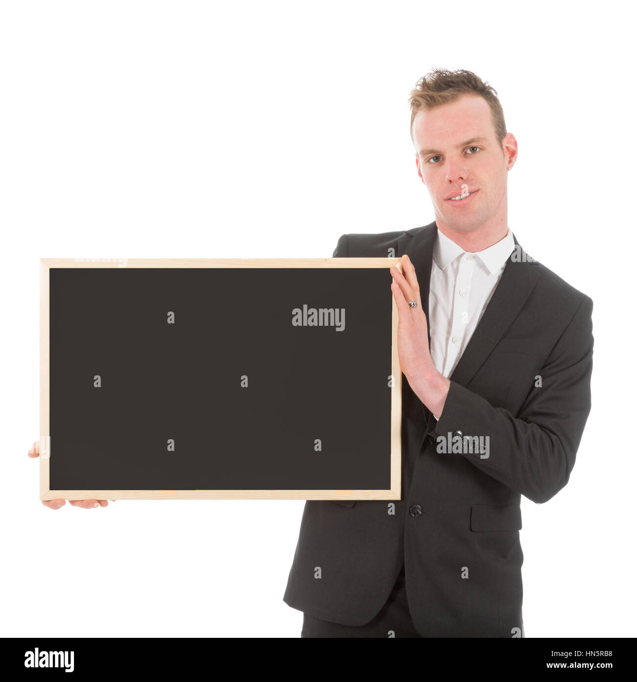 Business man holding empty chalkboard beside of his body, isolated on white Stock Photo