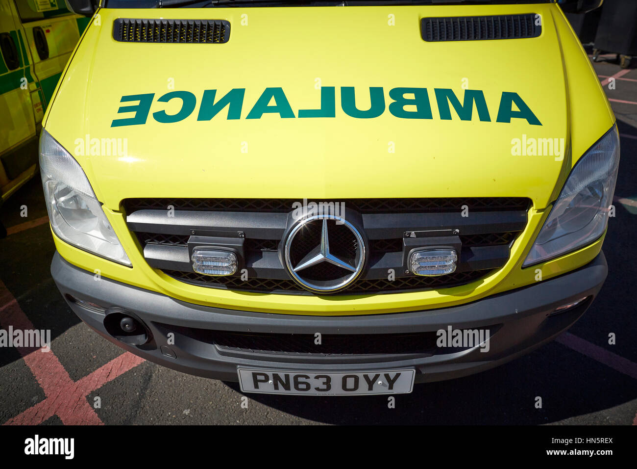 liveried ambulances parked on duty in designated bays at Manchester Royal Infirmary  accident and emergency department Stock Photo