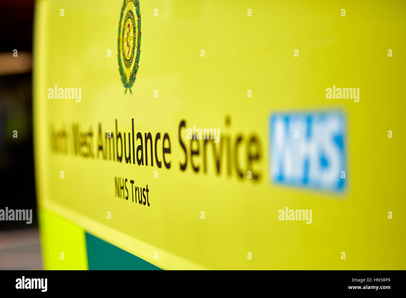 liveried ambulances parked on duty in designated bays at Manchester Royal Infirmary  accident and emergency department Stock Photo