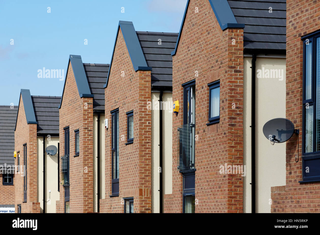Sunny day close up of modern design new build Barratt brick housing estate development site, in England UK Stock Photo