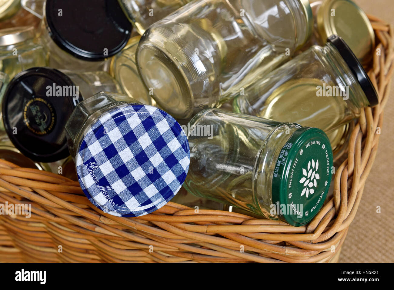Empty glass jars in basket washed and ready for reuse, storage or recycling, zero waste. Stock Photo