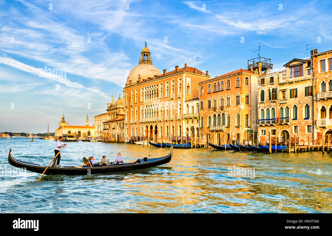 Gondola on the Grand Canal in front of the Basilica Santa Maria della Salute, Venice Stock Photo