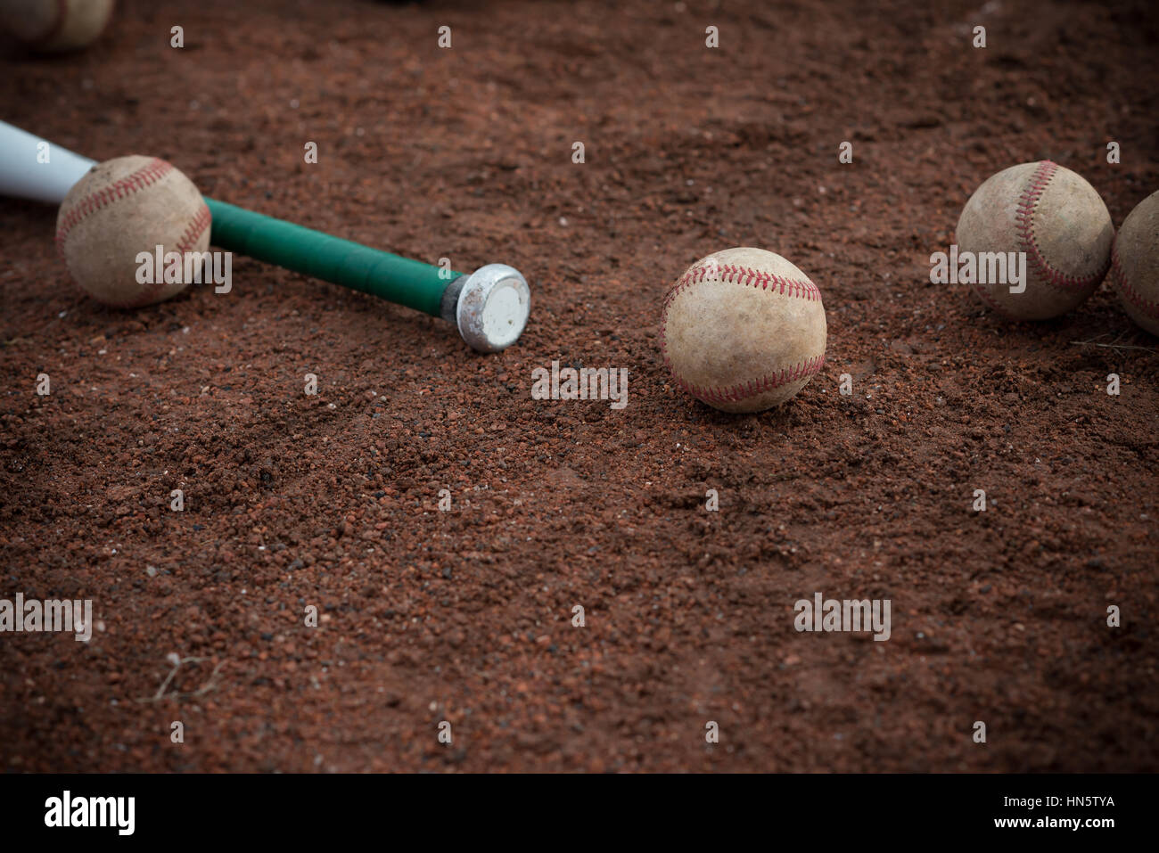 baseball bat and balls on floor Stock Photo Alamy