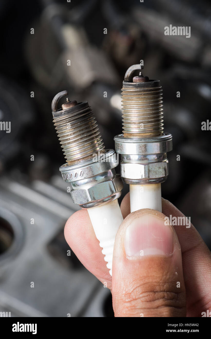 used spark plugs with soot Stock Photo Alamy