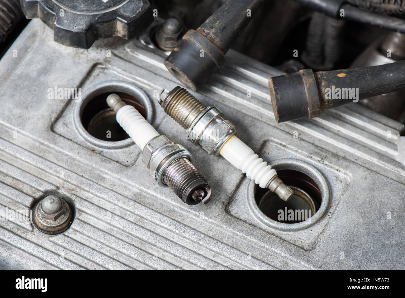 used spark plugs with soot Stock Photo Alamy