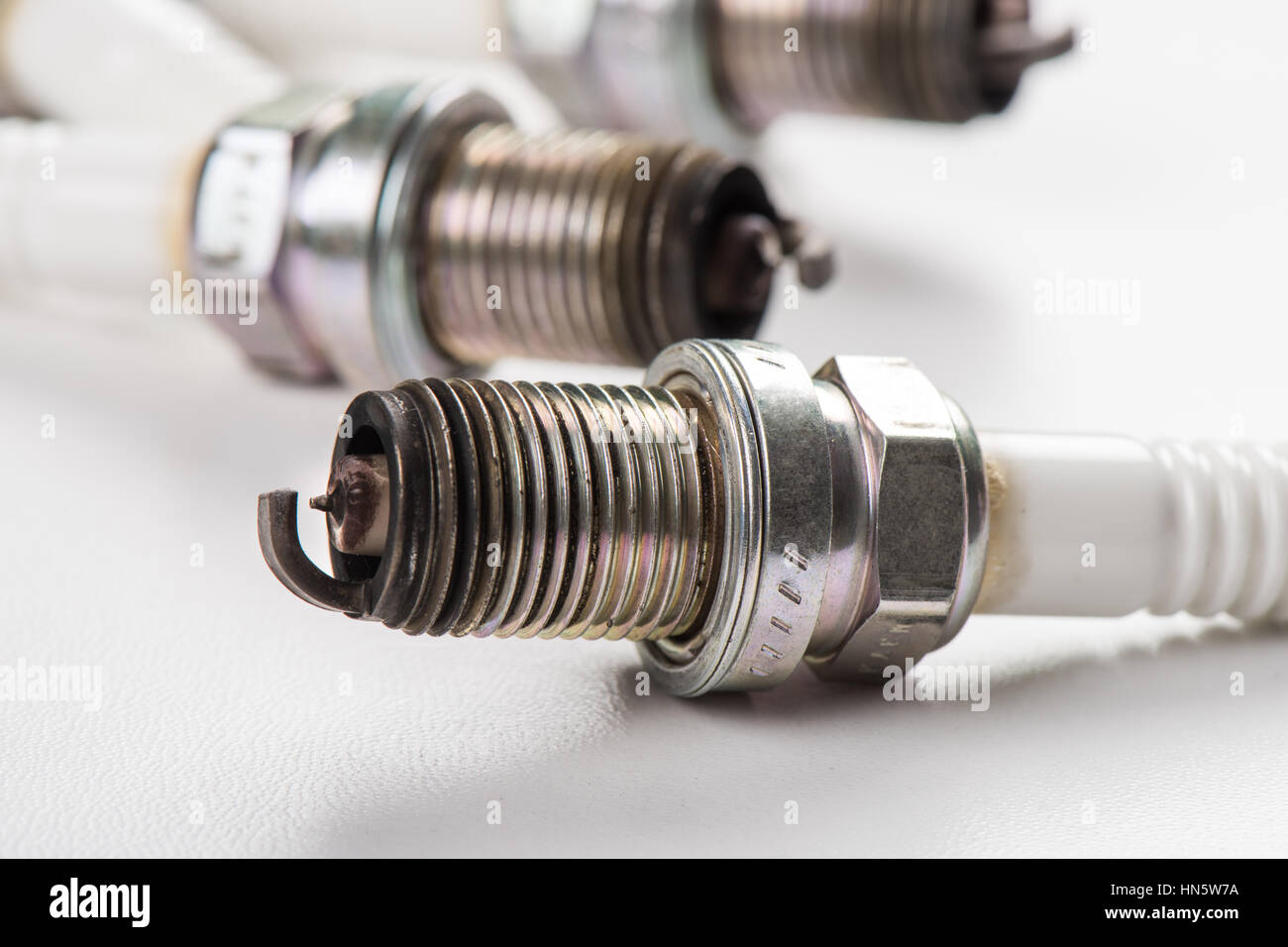 used spark plugs with soot Stock Photo Alamy