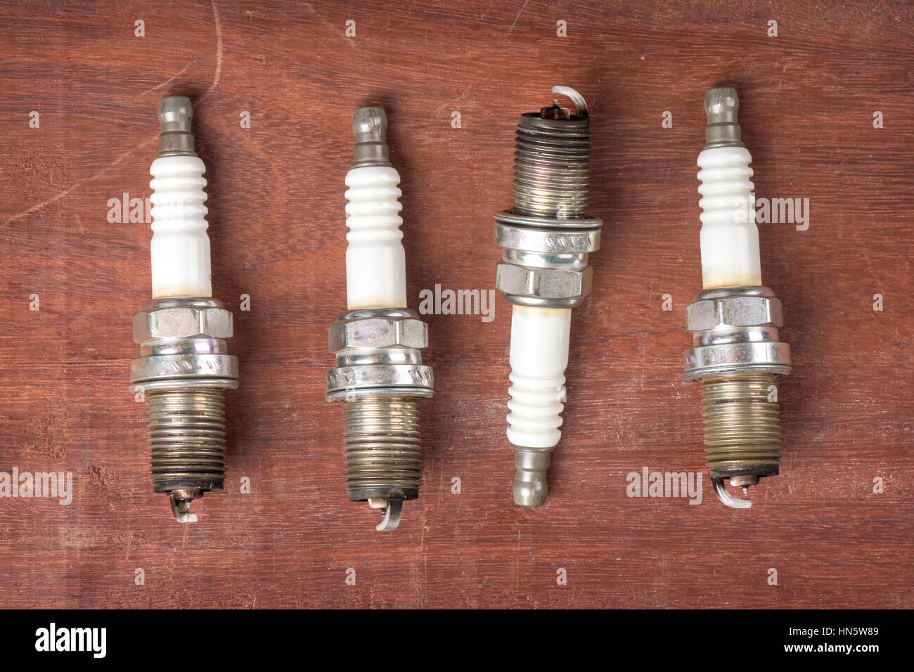 used spark plugs with soot Stock Photo Alamy