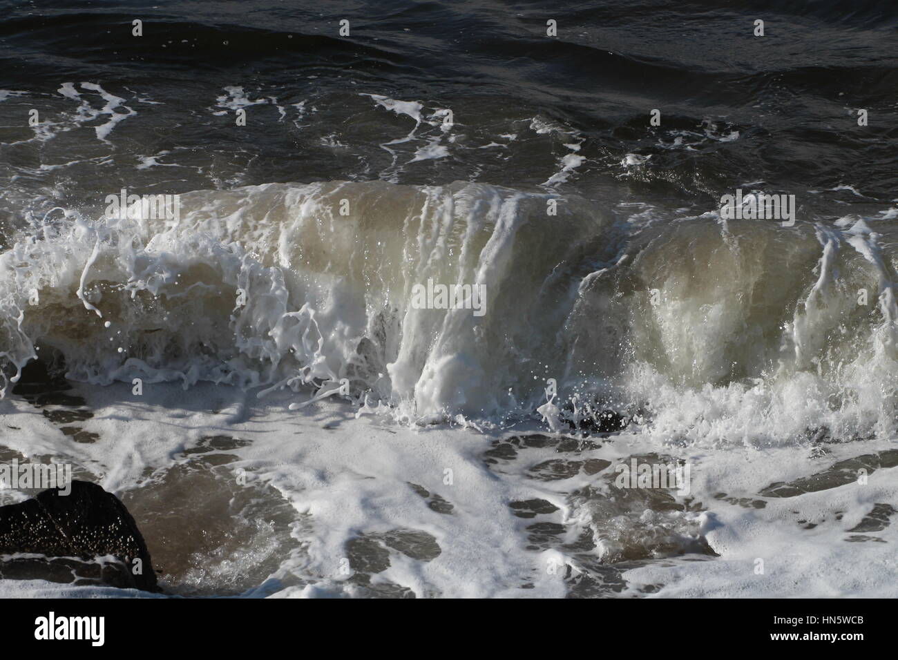 Waves breaking on a rocky shoreline Stock Photo - Alamy