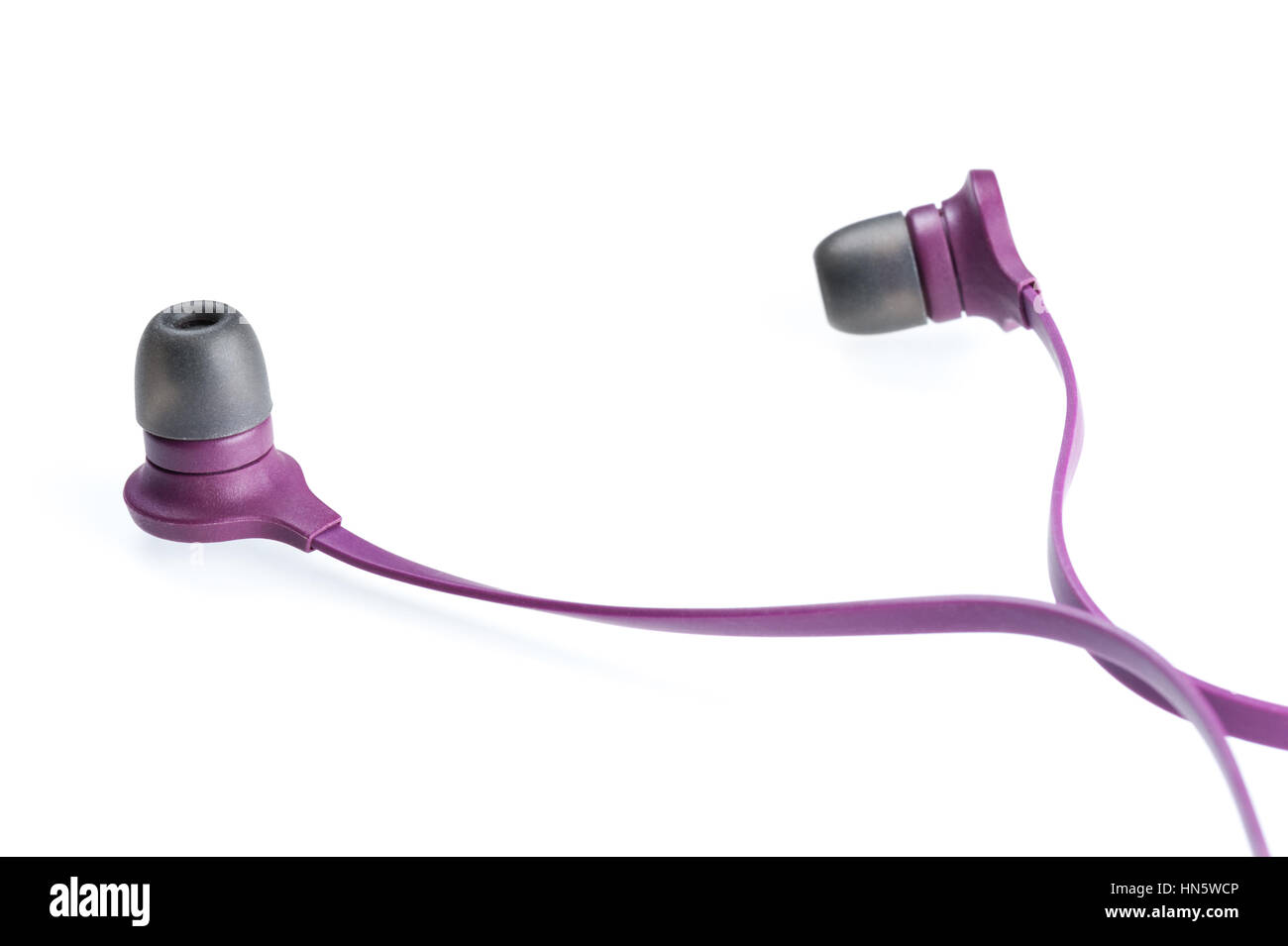 a Pair of purple earphones on white background Stock Photo Alamy