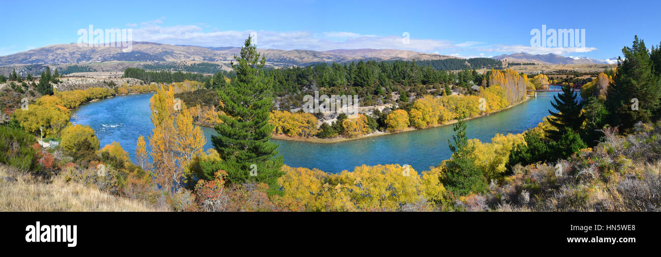 Panoramic view of the Clutha River and Bridge in Autumn. One of New Zealand's longest and most beautiful rivers and popular for trout fishing. Stock Photo