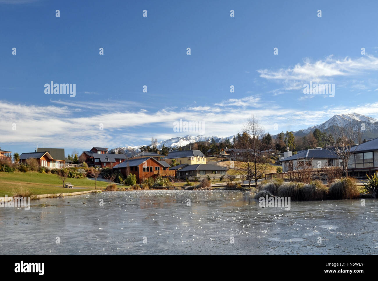 Hanmer Springs - popular tourist spa mountain village and frozen lake in the middle of Winter, New Zealand. Copy space available. Stock Photo