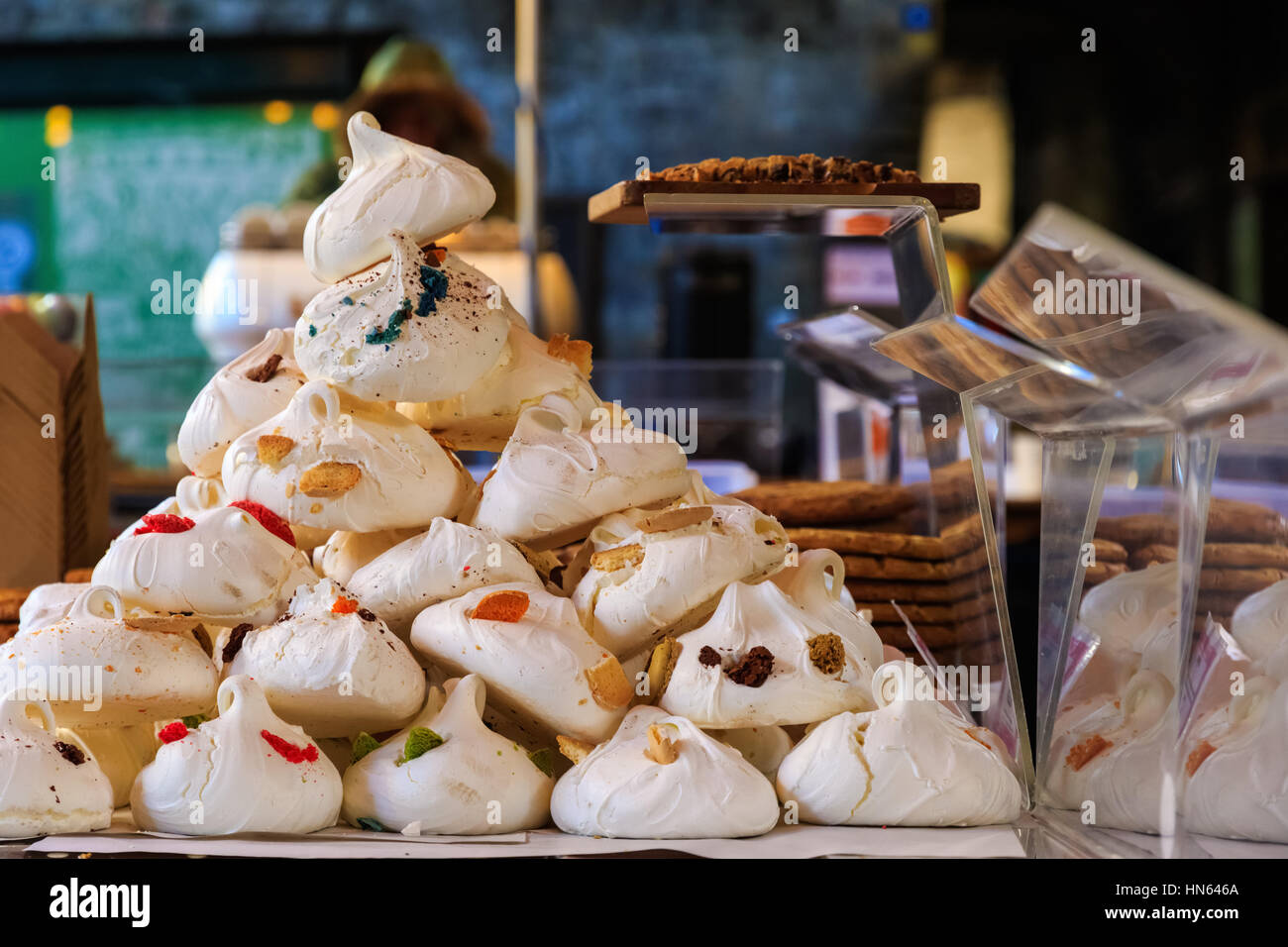 Meringues on display on a confectionery stall at Borough Market in