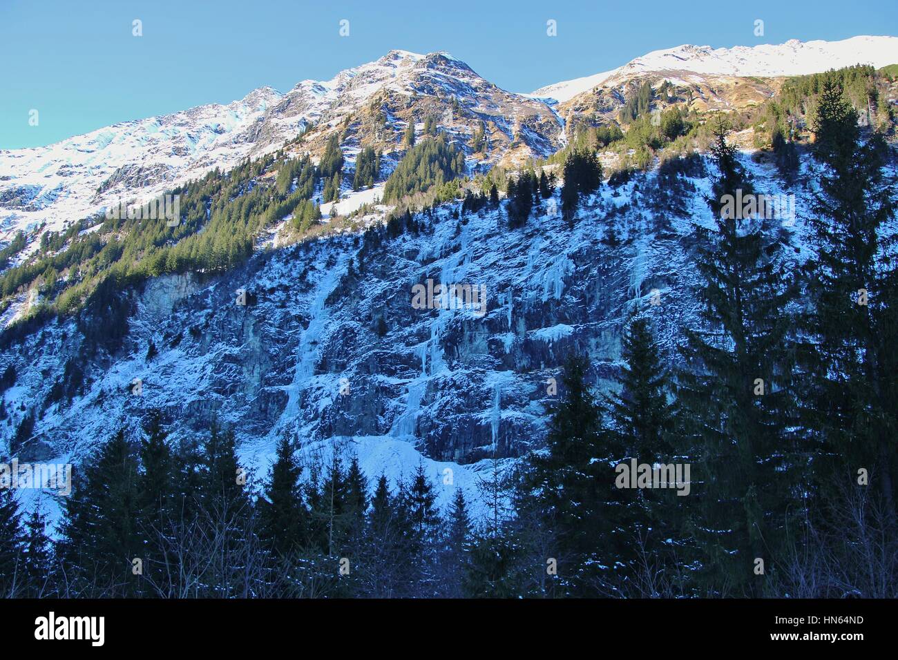 Gastein mountains in winter: Waterfalls are frozen to icicles. Near Bockstein and Bad Gastein, Austria, Europe. Approx. 1200 m above sea level. Stock Photo