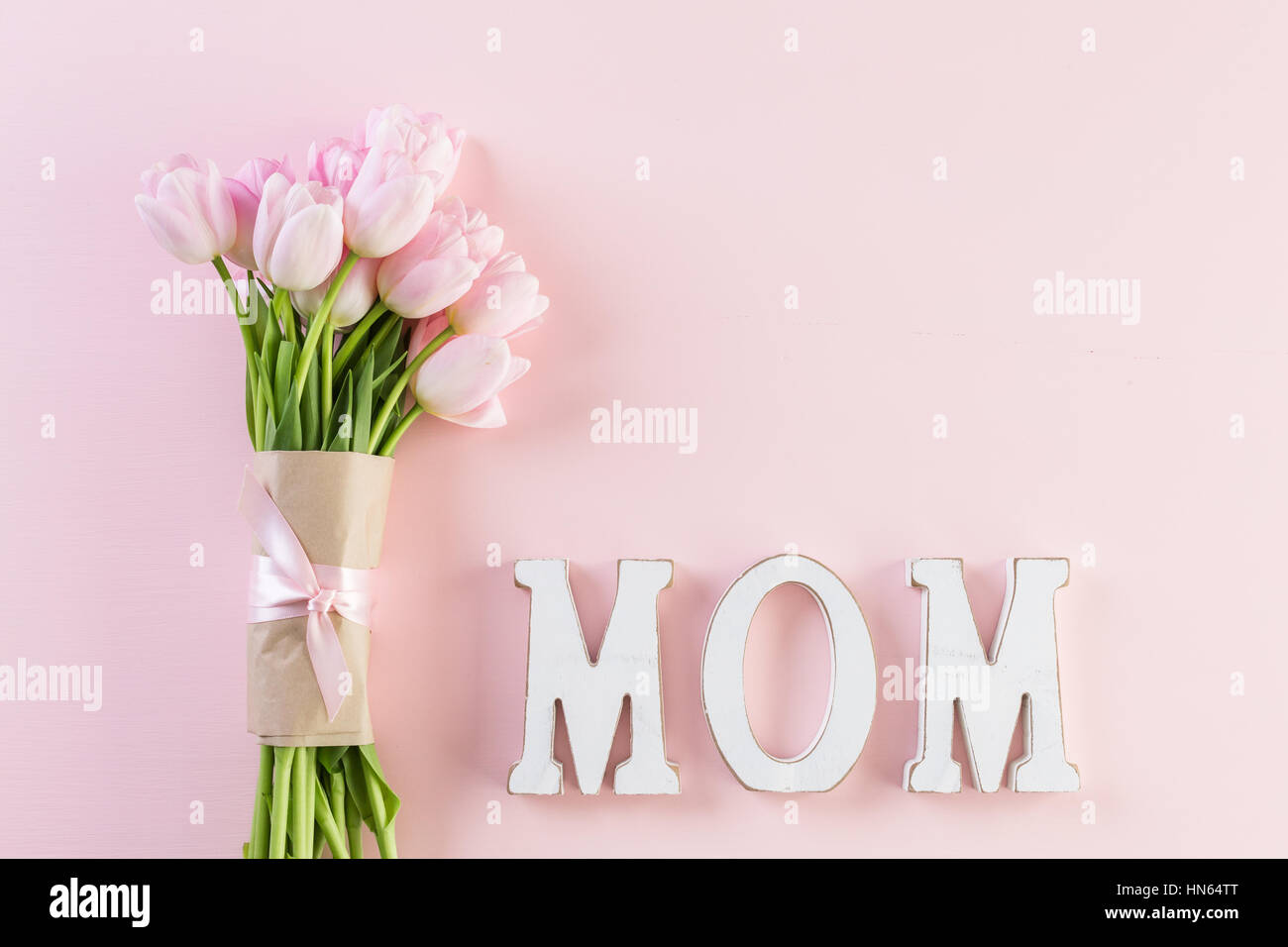 Bouquet of pink tulips on a pink background Stock Photo - Alamy