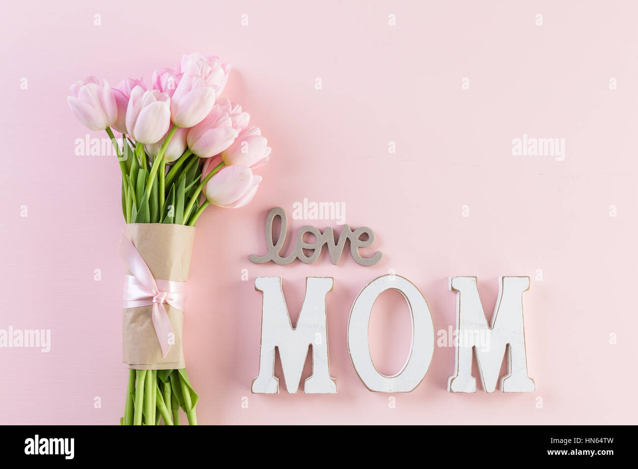 Bouquet of pink tulips on a pink background Stock Photo - Alamy