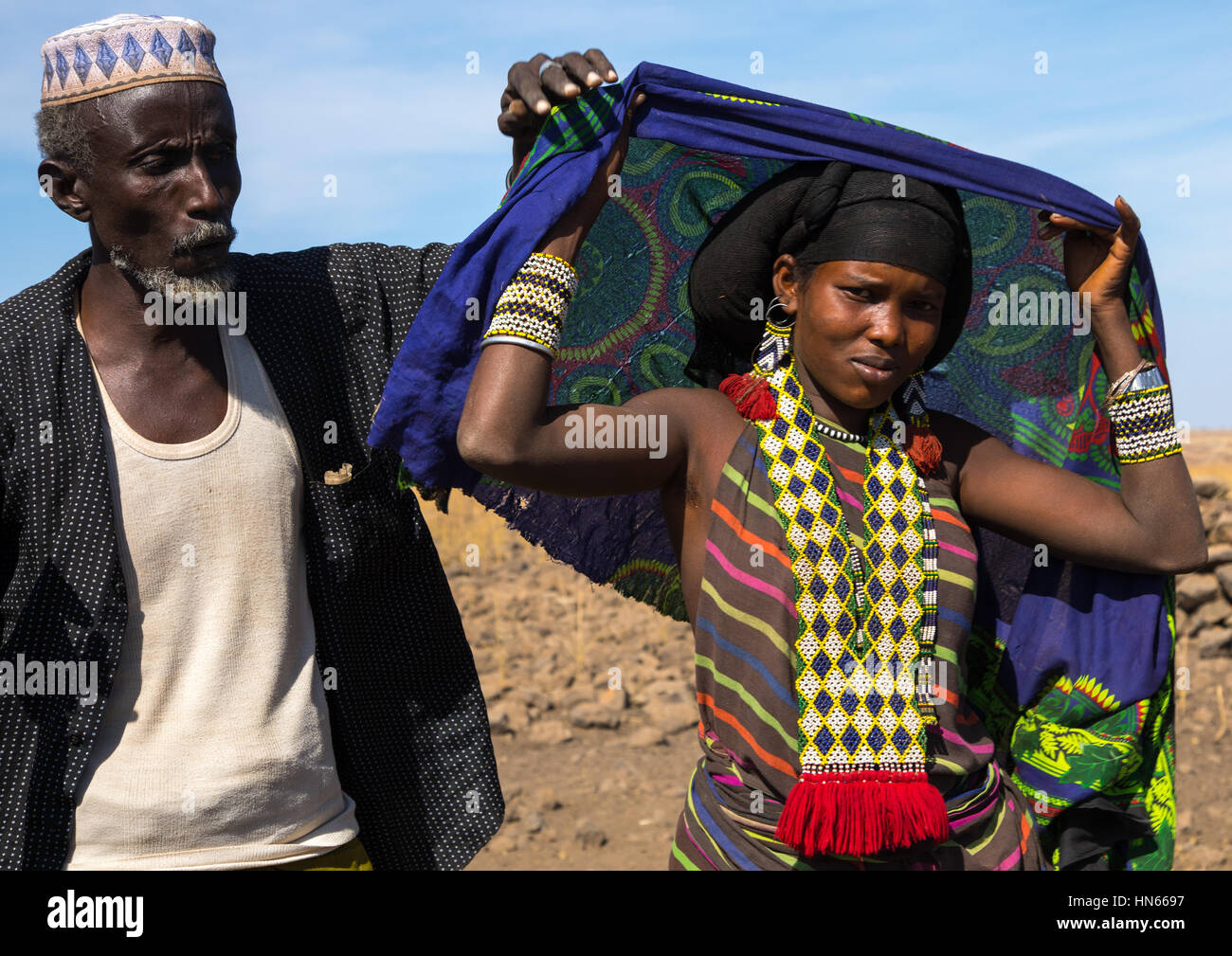 Issa tribe husband with his wife, Afar region, Yangudi Rassa National Park, Ethiopia Stock Photo