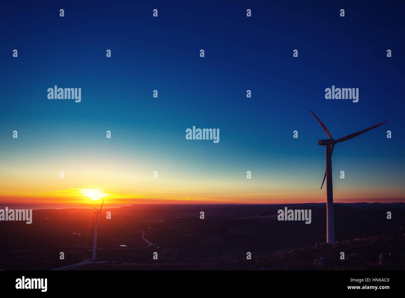 Solar wind turbines at sunset Stock Photo - Alamy
