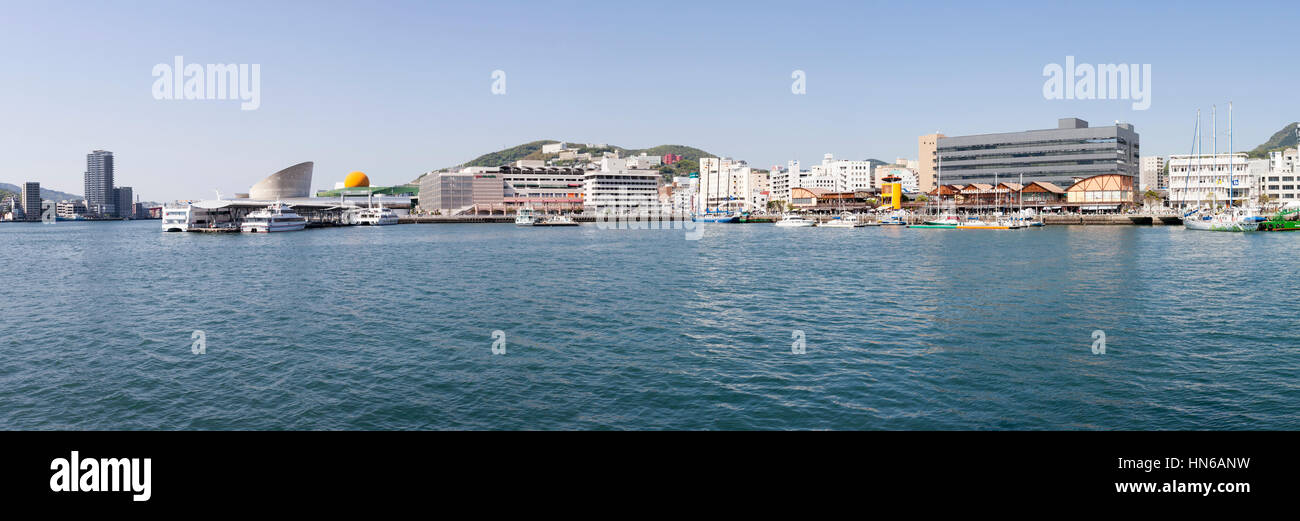 NAGASAKI, JAPAN - APRIL 27: Panoramic view of the ferry terminal and Dejima Wharf at Nagasaki, Japan on 27th April 2012. The modern developments are b Stock Photo