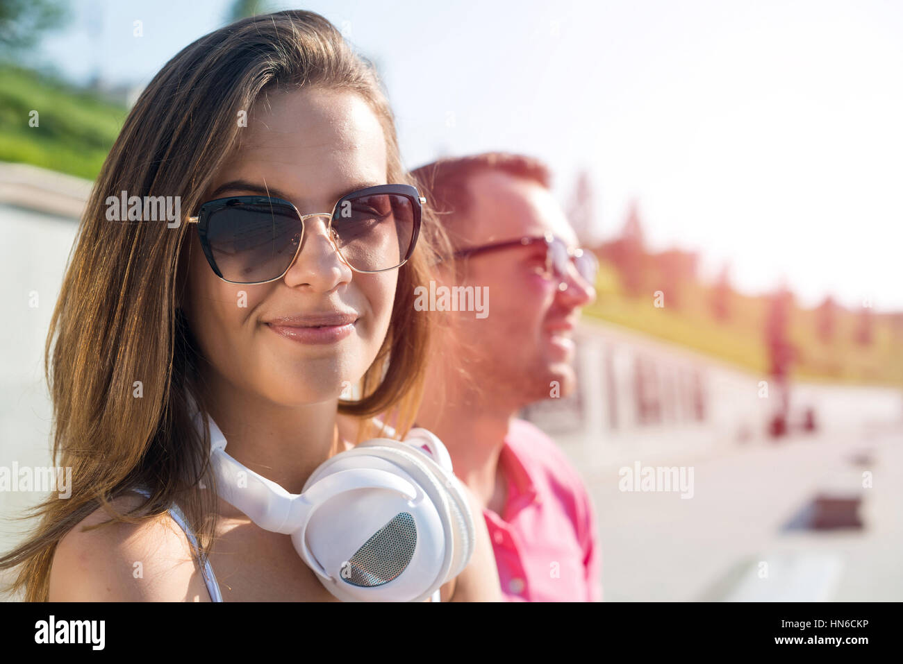 Young happy smiling couple having date outdoors Stock Photo - Alamy