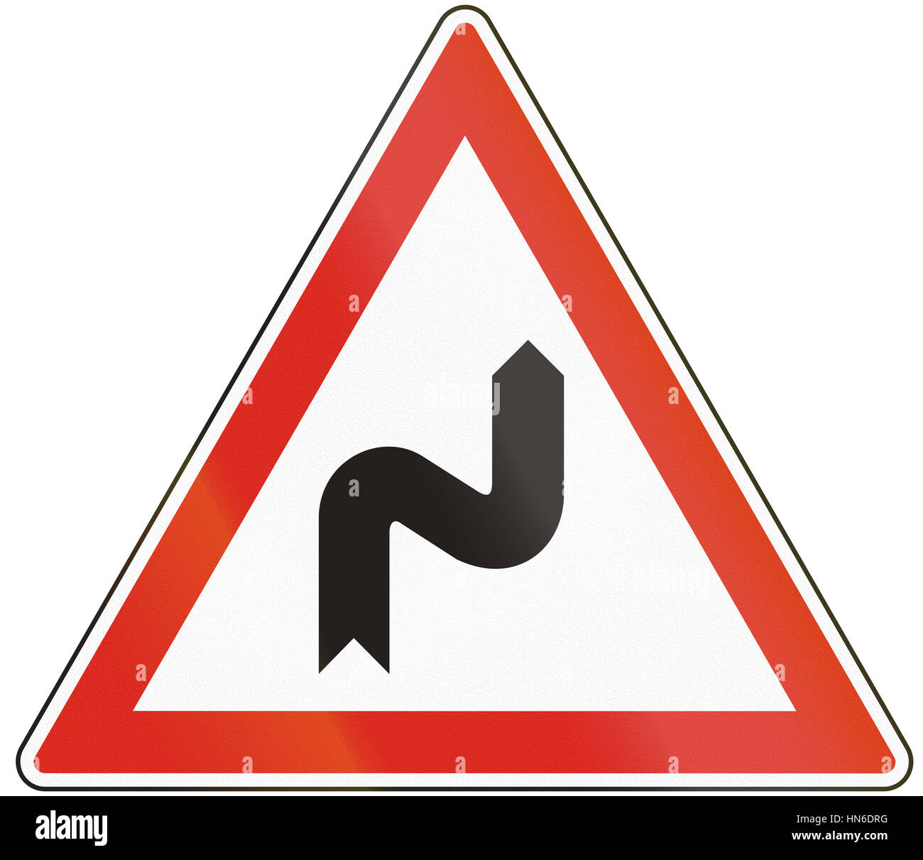 Hungarian warning road sign - Double bend, first to right. Stock Photo