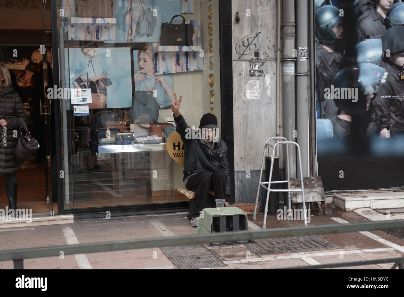 Athens, Greece. 08th Feb, 2017. A homeless salutes the greek firemen ...
