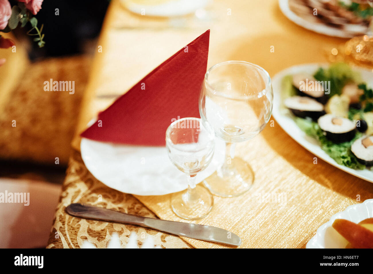Formal stylish setting on a dinner table with elegant glassware Stock Photo