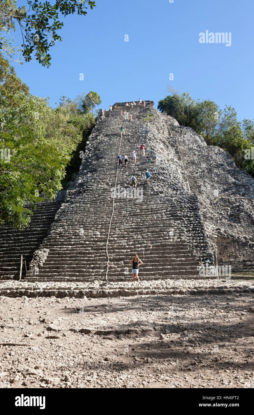 Tourist climbing Nohoch Mul the temple pyramid, Ancient Mayan civilization, Yucatan Peninsula, Mexican state of Quintana Roo, Mexico Stock Photo