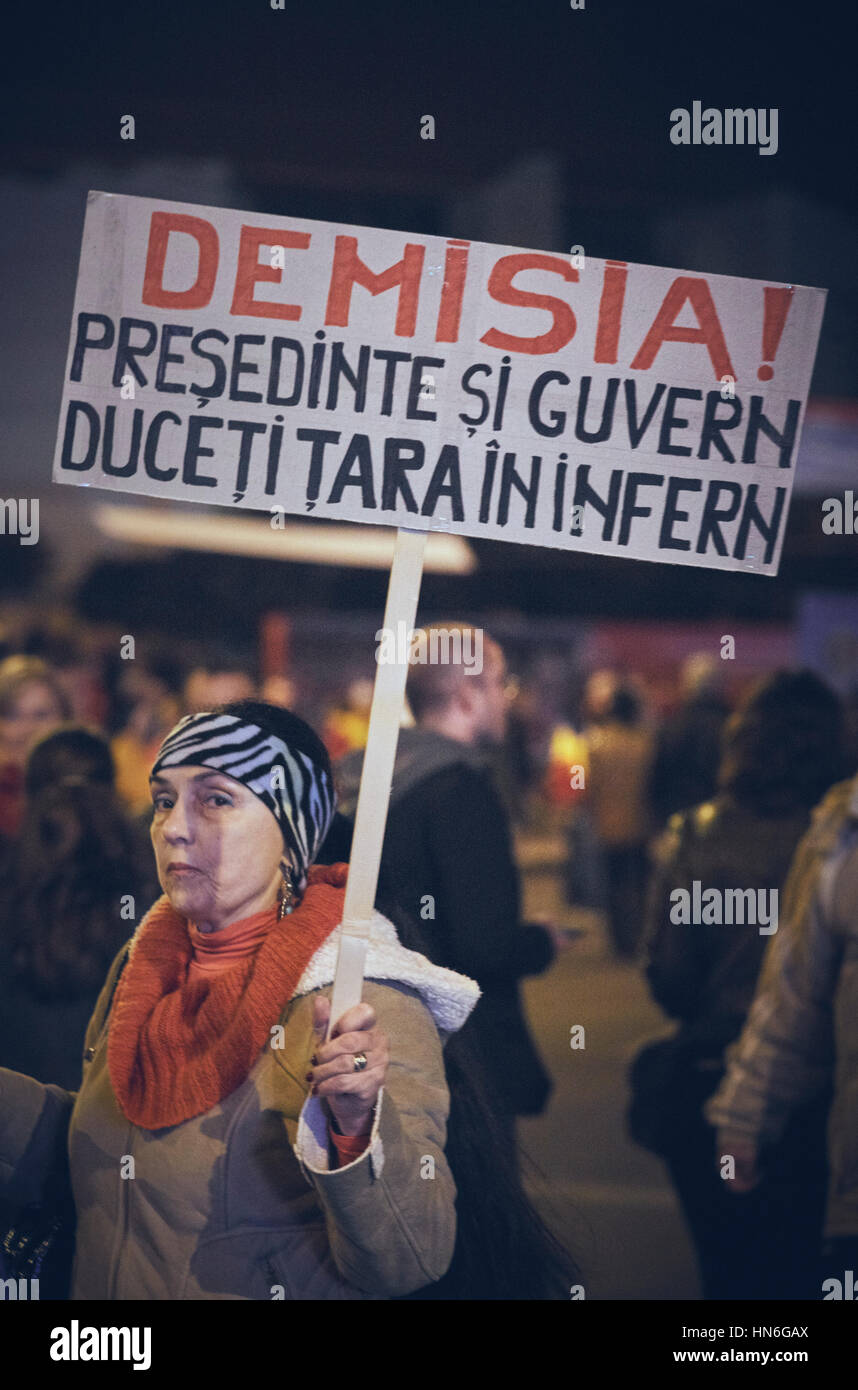 Bucharest, Romania - October 6, 2013: Adult woman holds a slogan placard during the mass riot against the cyanide gold extraction in Rosia Montana Stock Photo