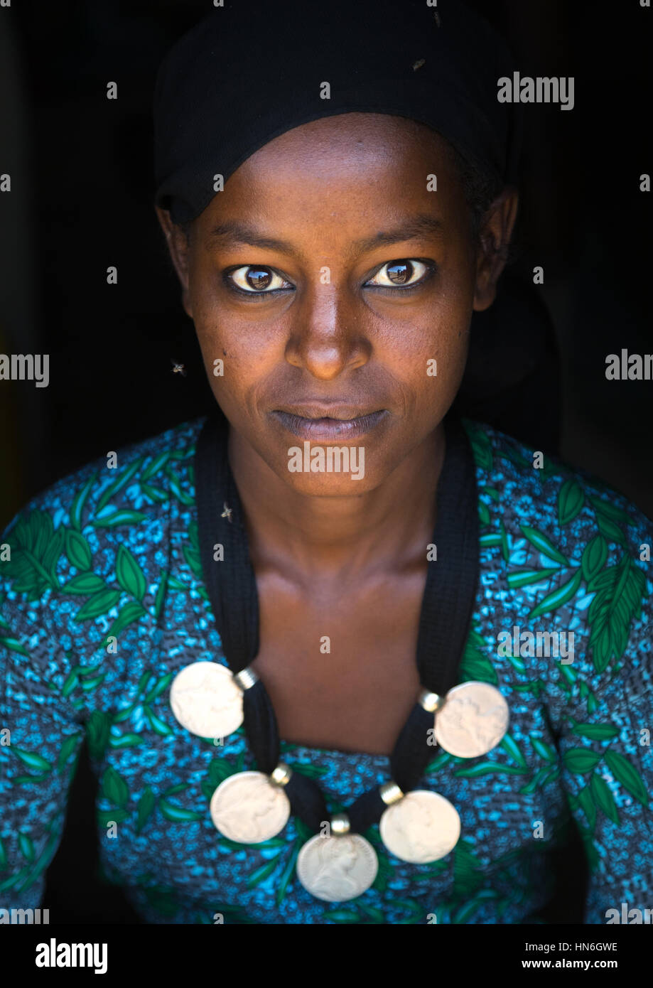 Portrait of an Oromo woman with maria theresa thalers necklace, Amhara region, Kemise, Ethiopia Stock Photo