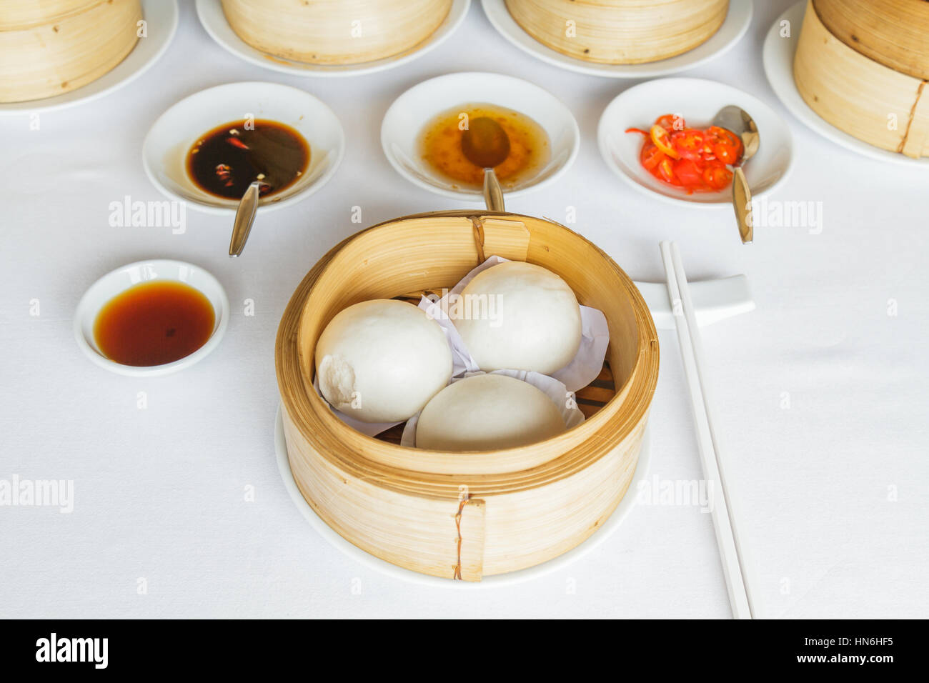 Dim sum food Steamed cream custard bun in bamboo basket at restaurant