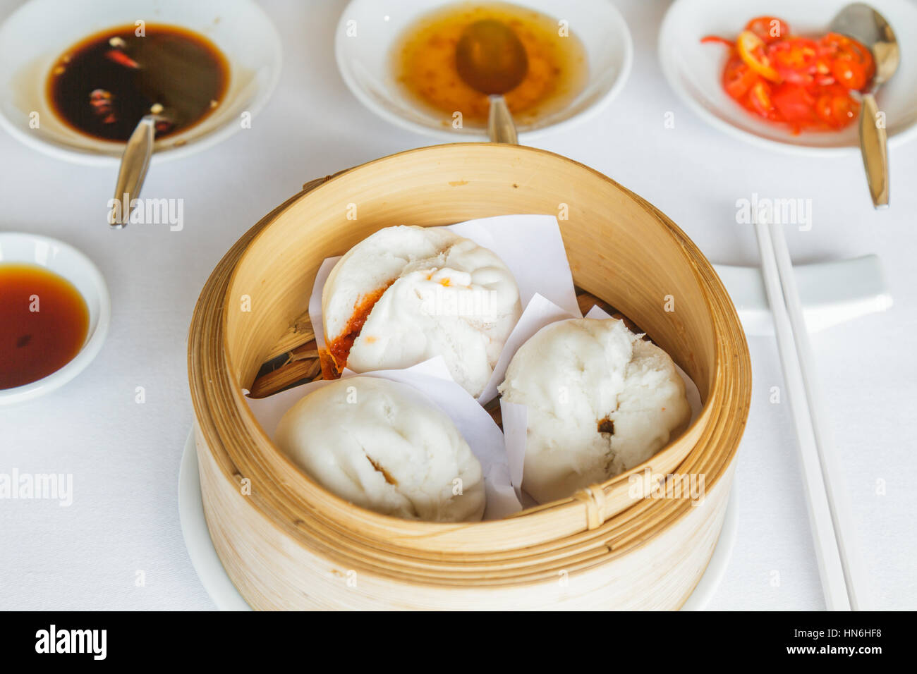 Dim sum food Steamed barbecue pork bun in bamboo basket at restaurant