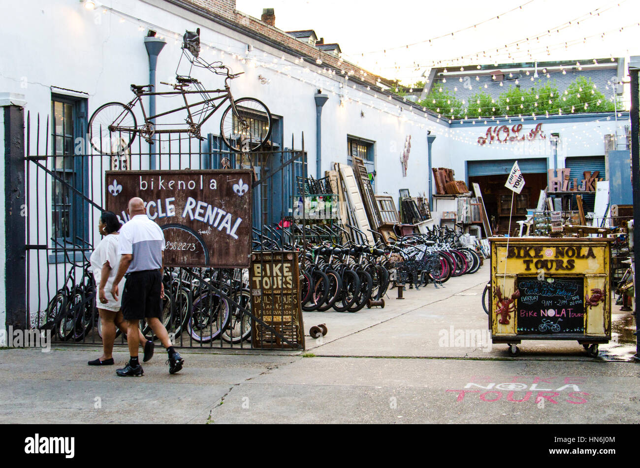 New Orleans, USA - July 8, 2015: A local bike rental shop with people walking in New Orleans, Louisiana. Stock Photo