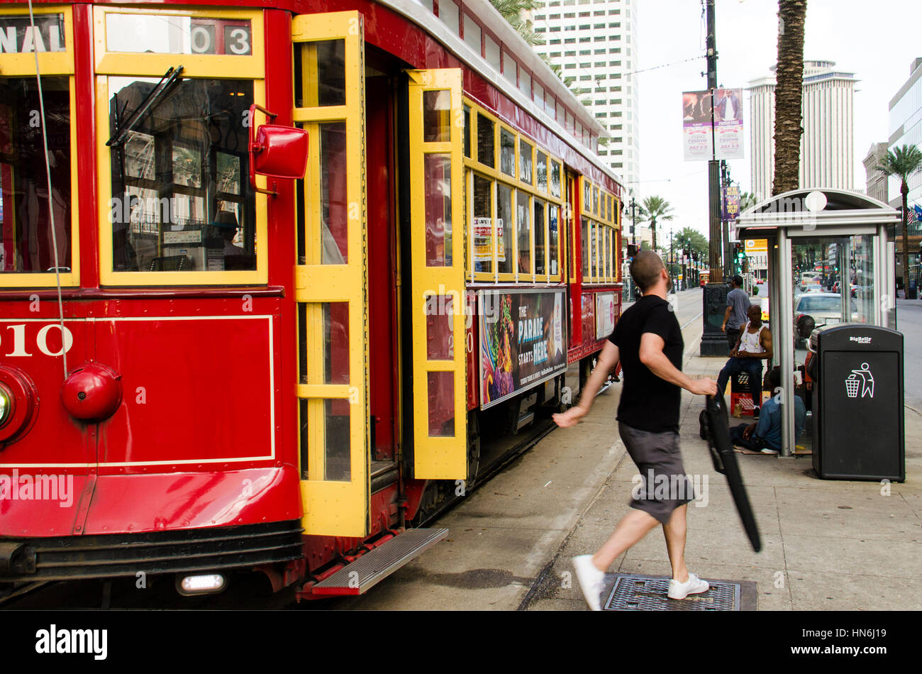 New Orleans, USA - July 8, 2015: People get off from a Canal Street line streetcar in the downtown of New Orleans, Louisiana. Stock Photo