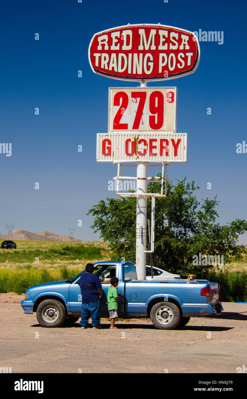 Red Mesa, Arizona, USA - August 6, 2015: Navajo people stand by their car at Red Mesa Trading Post and Gas Station, Arizona Stock Photo