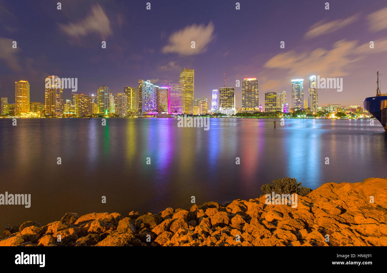 Miami skyline with Bayfront Park in the foreground overlooking Biscayne Bay at dusk viewed from Dodge Island. Stock Photo