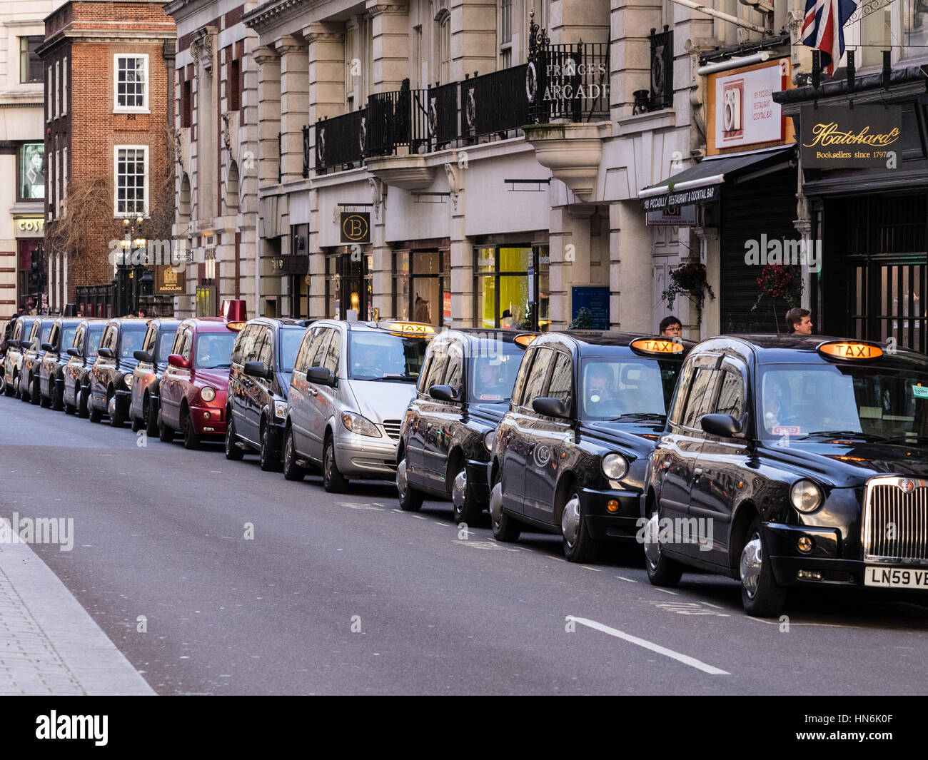 Taxi Rank London Taxis Black Cabs queue for passengers in Piccadilly, Central London Stock Photo